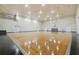 Community gym featuring a basketball court, multiple doors and bright lighting at 130 Southern Pecan Cir # 205, Winter Garden, FL 34787