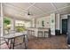 Outdoor kitchen and seating area with granite counters and brick flooring at 130 Southern Pecan Cir # 205, Winter Garden, FL 34787