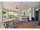 Community outdoor kitchen with granite counters, seating, and access to amenities at 130 Southern Pecan Cir # 205, Winter Garden, FL 34787