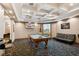 Recreation room includes billiard table, TV, unique patterned carpet and decorative ceiling at 130 Southern Pecan Cir # 205, Winter Garden, FL 34787