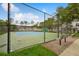 Community tennis court with new nets, benches, and well-maintained landscaping at 130 Southern Pecan Cir # 205, Winter Garden, FL 34787