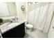 Bathroom featuring a black vanity with granite countertops and tiled floors at 1823 Pristine Loop, Lakeland, FL 33811