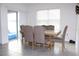 Bright dining area features tile flooring, a large window, and sliding glass doors to the outside at 1823 Pristine Loop, Lakeland, FL 33811