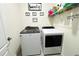 Modern laundry room featuring a new washer and dryer with custom decor at 1823 Pristine Loop, Lakeland, FL 33811