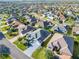 Expansive aerial view of a residential community with well-maintained homes and manicured landscaping at 2518 Foxbridge Ter, The Villages, FL 32162