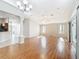 Bright living room with wood floors, ceiling fan, and sliding glass doors to the patio at 2518 Foxbridge Ter, The Villages, FL 32162