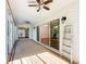 Sunroom with ceiling fans and sliding glass doors at 2518 Foxbridge Ter, The Villages, FL 32162