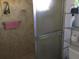 Bathroom features a shower with glass door, towel rack with pink towel, and shelving at 894 Superior St, Deltona, FL 32725