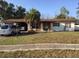 Charming single-story home features a well-kept lawn and mature landscaping at 894 Superior St, Deltona, FL 32725