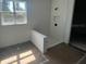 Modern bathroom with a tiled shower, a small window, and neutral color palette at 3611 Chelsea St, Orlando, FL 32803