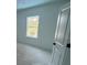Bright bedroom with a window and minimalist design at 3611 Chelsea St, Orlando, FL 32803