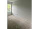 Unfinished bedroom with light streaming in from an outside window at 3611 Chelsea St, Orlando, FL 32803