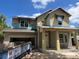 Two-story home under construction features a welcoming front porch and large windows at 3611 Chelsea St, Orlando, FL 32803