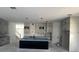 Spacious kitchen with a large island, modern pendant lighting, and ample cabinet space at 3611 Chelsea St, Orlando, FL 32803