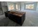 Open-concept kitchen with island and natural light, perfect for entertaining and cooking at 3611 Chelsea St, Orlando, FL 32803