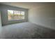 A bright living room with a large window and a minimalist design at 3611 Chelsea St, Orlando, FL 32803