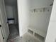 Mud room with built-in bench and hooks to keep organized at 3611 Chelsea St, Orlando, FL 32803