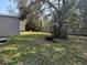 Spacious backyard featuring a shed and a wooden fence, perfect for outdoor activities at 1721 S Village Dr, Deltona, FL 32725