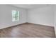 Bright and spacious bedroom with wood-look floors, a window and neutral color scheme at 2674 Sw 165Th Street Rd, Ocala, FL 34473