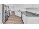 Modern kitchen with stainless steel appliances, granite countertops, and ample cabinet space at 2674 Sw 165Th Street Rd, Ocala, FL 34473