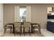 Classic dining room with a wooden table, upholstered chairs, and natural light from a window at 3486 Howell Dr, Lake Wales, FL 33859