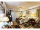 Bedroom features floral accents, a ceiling fan, and sliding glass doors at 105 Country Club Ln, Mulberry, FL 33860
