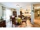 Cozy dining area with tile flooring and an open view into the inviting living room at 105 Country Club Ln, Mulberry, FL 33860