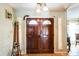 Elegant entryway featuring a double door with decorative glass and charming sidelights at 105 Country Club Ln, Mulberry, FL 33860