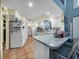 Bright eat-in kitchen with tile floors, white cabinetry and tile backsplash at 105 Country Club Ln, Mulberry, FL 33860