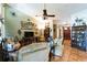 Bright living room featuring a vaulted ceiling and multiple doorways at 105 Country Club Ln, Mulberry, FL 33860