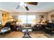 Home office featuring tile floors, ceiling fan, lots of decor and space for working at 105 Country Club Ln, Mulberry, FL 33860