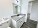 Bathroom features a granite vanity, and a toilet at 1390 Patricia St, Kissimmee, FL 34744