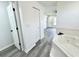 View of bathroom between bedroom door and the bathtub and shower at 1390 Patricia St, Kissimmee, FL 34744