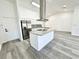 Modern kitchen showcasing stainless steel appliances and a functional island at 1390 Patricia St, Kissimmee, FL 34744