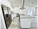 Well-equipped kitchen featuring stainless steel appliances and a central island at 1390 Patricia St, Kissimmee, FL 34744