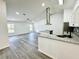 Bright open-concept living space featuring modern flooring and eat-in kitchen at 1390 Patricia St, Kissimmee, FL 34744