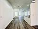 Open-concept living space with modern flooring and abundant natural light at 1390 Patricia St, Kissimmee, FL 34744