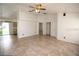 Bright living room with tile floors, ceiling fan, and neutral paint, creating a welcoming atmosphere at 250 Ashley Rd, Mascotte, FL 34753