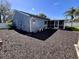 View of the home's backyard and screened-in patio, perfect for enjoying the outdoors at 105 Ingram Cir, Longwood, FL 32779