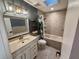 Bathroom with jacuzzi tub, decorative fixtures, and floating shelves at 105 Ingram Cir, Longwood, FL 32779