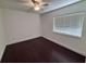 Bedroom with hardwood floors, ceiling fan, and window with blinds at 105 Ingram Cir, Longwood, FL 32779