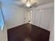 Bedroom featuring hardwood floors, ceiling fan, window, and closet with doors at 105 Ingram Cir, Longwood, FL 32779