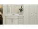 A bright bathroom featuring white cabinets, quartz countertops, and chrome hardware at 2065 Lasso Loop, Eagle Lake, FL 33839