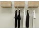 Practical closet with hanging clothes and organized storage solutions at 2077 Lasso Loop, Eagle Lake, FL 33839