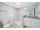 Bathroom featuring tiled stand up shower, white cabinets and granite countertops at 215 Maple Ln, Fort Meade, FL 33841