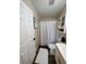 Bright bathroom with a shower, modern fixtures, vanity, and white wood cabinets at 228 Babson Dr, Babson Park, FL 33827