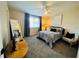 Cozy bedroom features carpet, a ceiling fan, and lots of natural light from the window at 228 Babson Dr, Babson Park, FL 33827