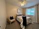 Inviting bedroom with a ceiling fan, soft carpet, and a window for natural light at 228 Babson Dr, Babson Park, FL 33827