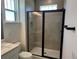Modern bathroom with glass enclosed shower and sleek black fixtures at 15088 Grove Lake Dr, Winter Garden, FL 34787