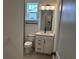 Contemporary bathroom featuring sleek vanity, modern fixtures, and tiled floors at 15088 Grove Lake Dr, Winter Garden, FL 34787